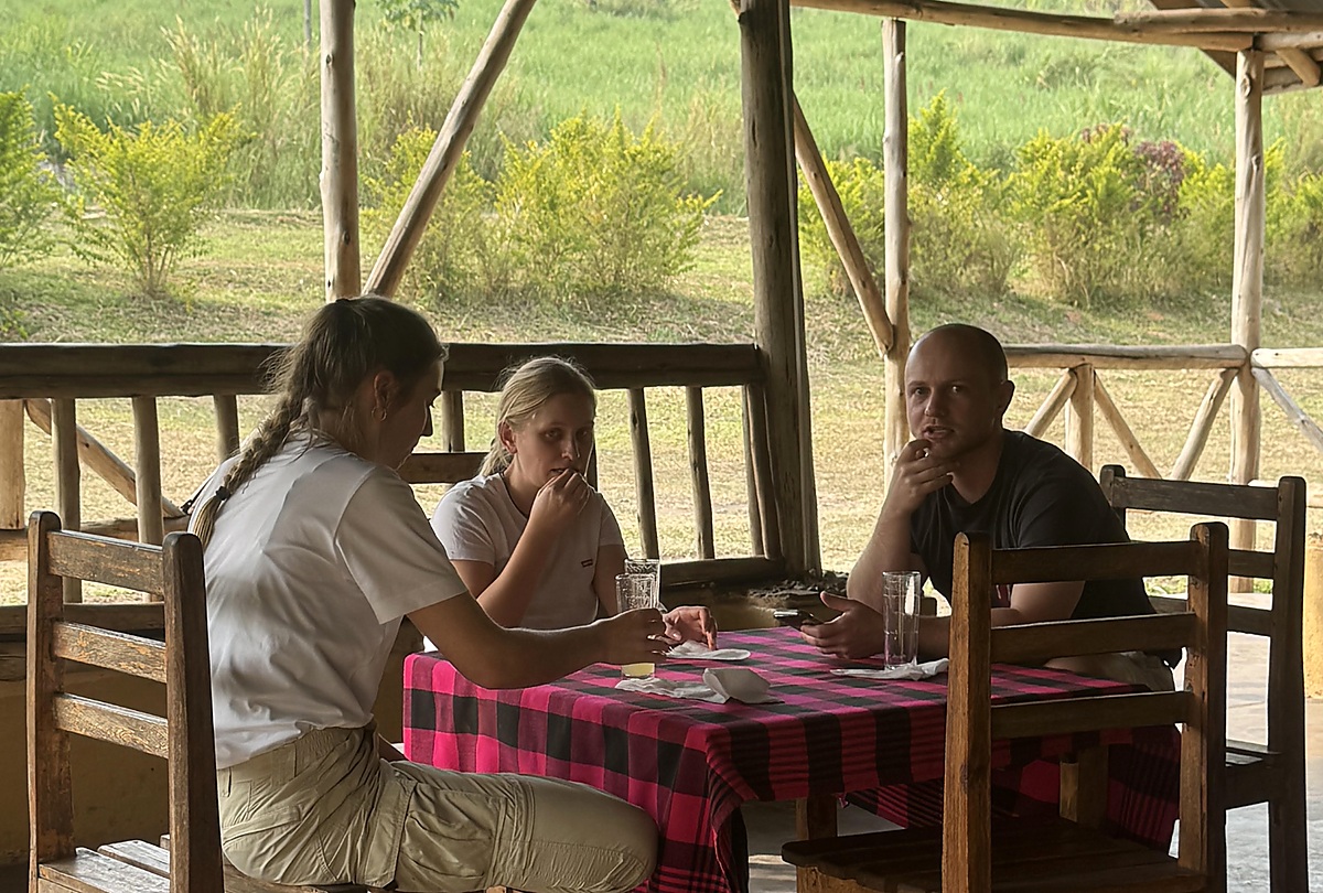 Guests enjoying a meal at Nguse River Camp in western Uganda