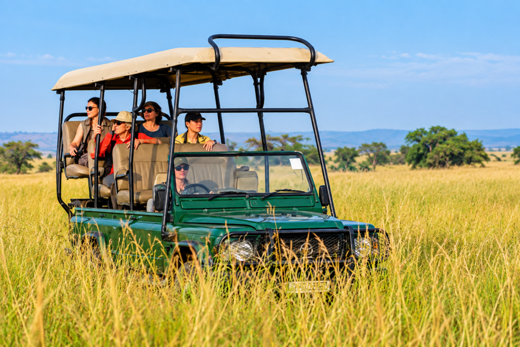 Safari game drive through open grassland in Uganda