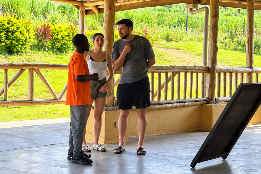 Travellers talking with staff at Nguse River Camp
