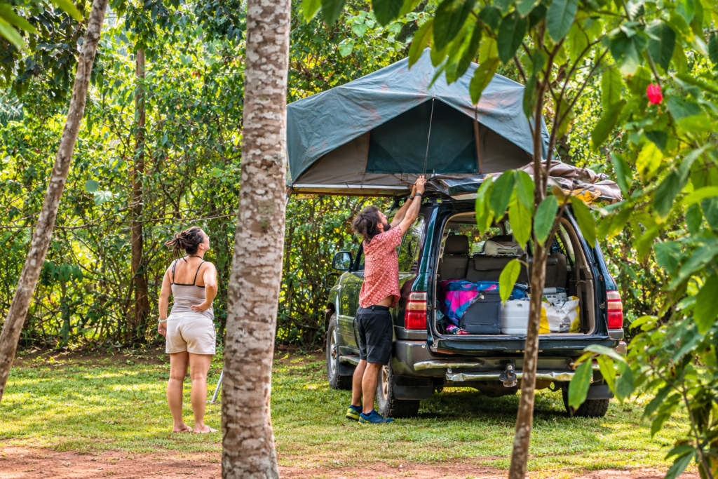 Travellers setting up rooftop tent car hire in Uganda